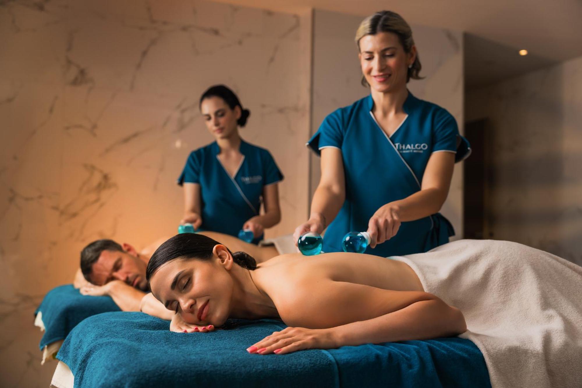 Hilton Rijeka Costabella Beach Resort And Spa Buitenkant foto A massage therapist performing a massage